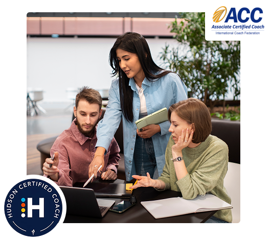 Executive coach guiding professionals during a leadership strategy session in office